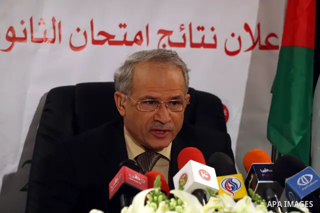 A member of the Palestinian Ministry of Education, Jihad Zakarnah speaks duting a press conference to announce the results of final high school exams, known as "Tawjihi" in the West Bank city of Ramallah on July 24,2011....