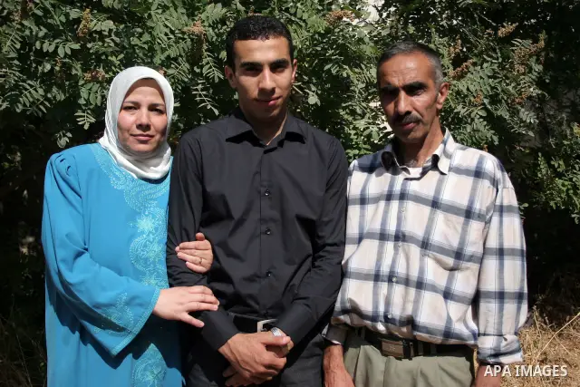 A Palestinian student from the top ten in the general secondary certificate in Palestine, Mohammed Jafar Karki with average of 99.5 % , is greeted by his family in the West Bank city of Hebron , Sunday, July 24, 2011. Ph...