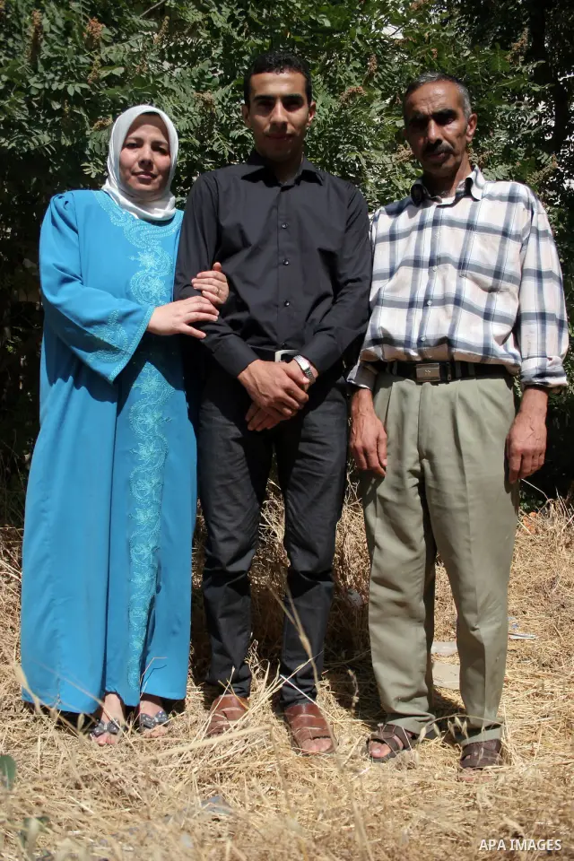 A Palestinian student from the top ten in the general secondary certificate in Palestine, Mohammed Jafar Karki with average of 99.5 % , is greeted by his family in the West Bank city of Hebron , Sunday, July 24, 2011. Ph...