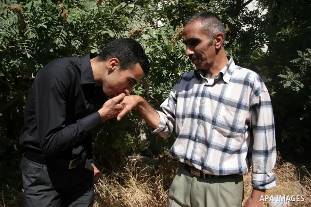 A Palestinian student from the top ten in the general secondary certificate in Palestine, Mohammed Jafar Karki with average of 99.5 % , is greeted by his family in the West Bank city of Hebron , Sunday, July 24, 2011. Ph...