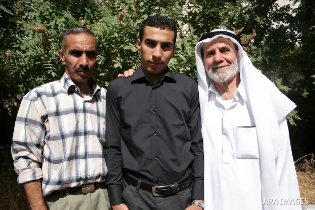 A Palestinian student from the top ten in the general secondary certificate in Palestine, Mohammed Jafar Karki with average of 99.5 % , is greeted by his family in the West Bank city of Hebron , Sunday, July 24, 2011. Ph...