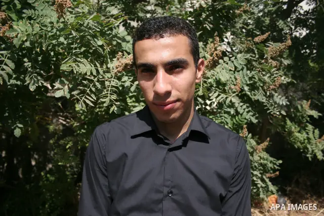 A Palestinian student from the top ten in the general secondary certificate in Palestine, Mohammed Jafar Karki with average of 99.5 % , is greeted by his family in the West Bank city of Hebron , Sunday, July 24, 2011. Ph...
