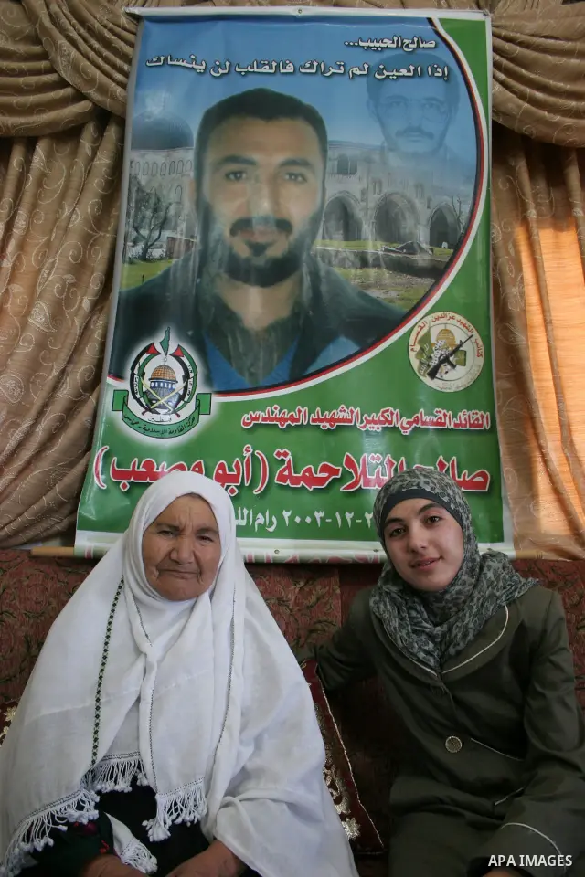 A Palestinian student from the top ten in the general secondary certificate in Palestine, Kataeb Saleh al-Talhma with average of 99.3 % , is greeted by her family in the West Bank city of Hebron , Sunday, July 24, 2011....