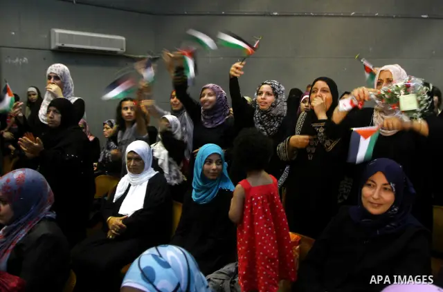 Palestinians participate in a celebration in Gaza city on July 24,2011 to honor the students who gained the highest marks in the final high school exams, known as "Tawjihi" at al-Shawwa theatre . Photo by Ashraf Amra