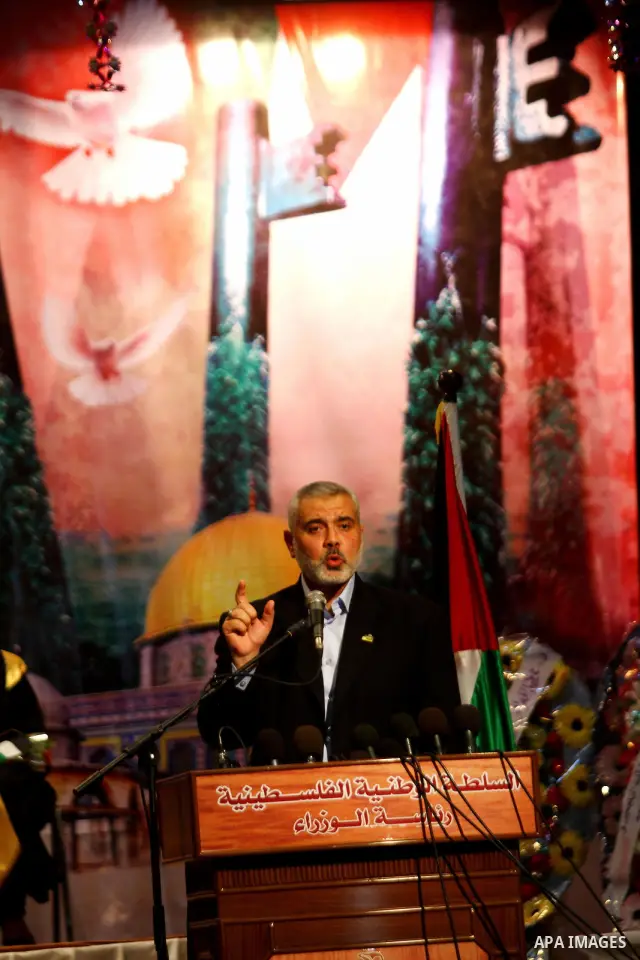 Palestinian Prime Minister in Gaza Strip, Ismail Haniya participates in a celebration in Gaza city on July 24,2011 to honor the students who gained the highest marks in the final high school exams, known as "Tawjihi" at...