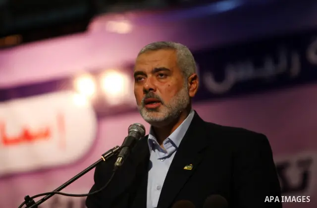 Palestinian Prime Minister in Gaza Strip, Ismail Haniya participates in a celebration in Gaza city on July 24,2011 to honor the students who gained the highest marks in the final high school exams, known as "Tawjihi" at...