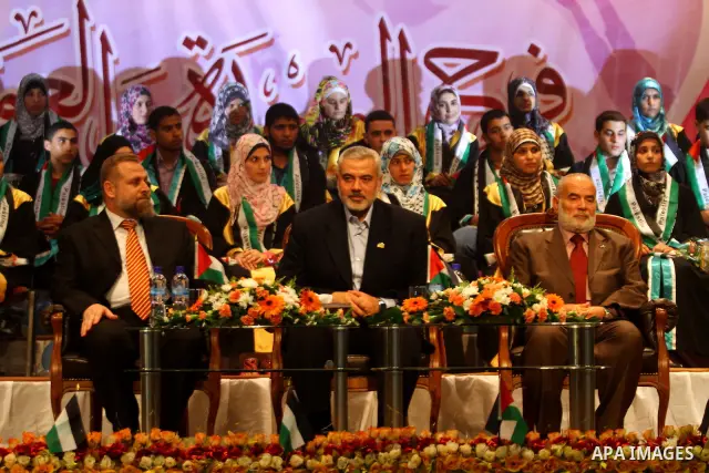 Palestinian Prime Minister in Gaza Strip, Ismail Haniya participates in a celebration in Gaza city on July 24,2011 to honor the students who gained the highest marks in the final high school exams, known as "Tawjihi" at...