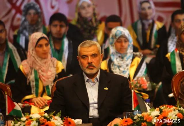 Palestinian Prime Minister in Gaza Strip, Ismail Haniya participates in a celebration in Gaza city on July 24,2011 to honor the students who gained the highest marks in the final high school exams, known as "Tawjihi" at...