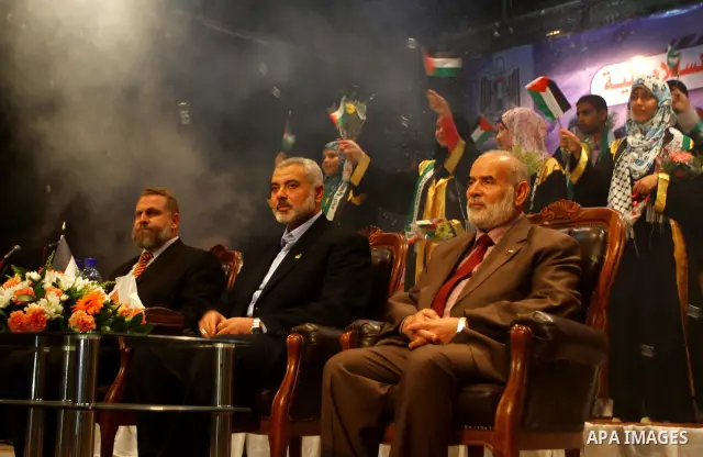 Palestinian Prime Minister in Gaza Strip, Ismail Haniya participates in a celebration in Gaza city on July 24,2011 to honor the students who gained the highest marks in the final high school exams, known as "Tawjihi" at...
