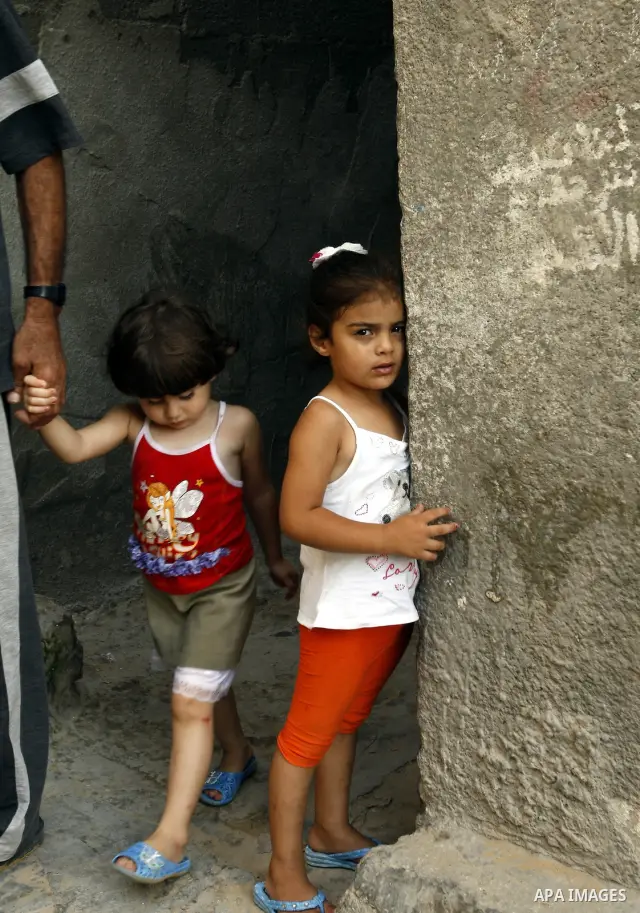 Palestinian children play in front of their house Al Shate` refugee camp in the west of Gaza City on July 25, 2011. Photo by Mahmud Nassar