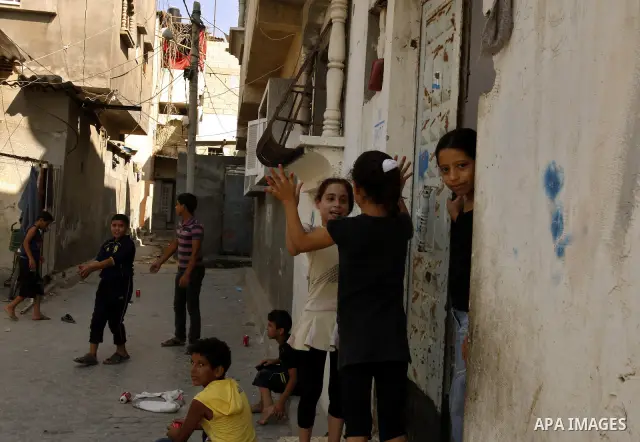 Palestinian children play in front of their house Al Shate` refugee camp in the west of Gaza City on July 25, 2011. Photo by Mahmud Nassar