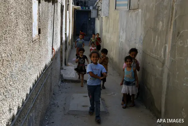 Palestinian children play in front of their house Al Shate` refugee camp in the west of Gaza City on July 25, 2011. Photo by Mahmud Nassar