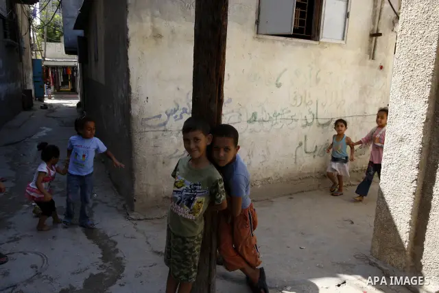 Palestinian children play in front of their house Al Shate` refugee camp in the west of Gaza City on July 25, 2011. Photo by Mahmud Nassar