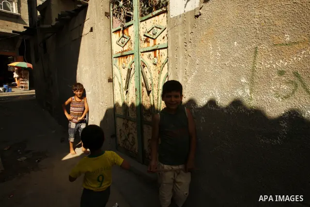 Palestinian children play in front of their house Al Shate` refugee camp in the west of Gaza City on July 25, 2011. Photo by Mahmud Nassar