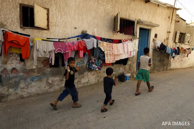 Palestinian children play in front of their house Al Shate` refugee camp in the west of Gaza City on July 25, 2011. Photo by Mahmud Nassar