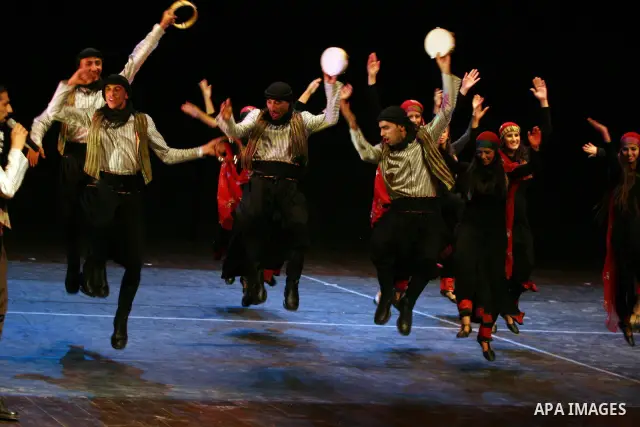 Palestinian folklore dance troupe perform during an annual cultural festival in the West Bank city of Ramallah on July 25, 2011. Photo by Issam Rimawi