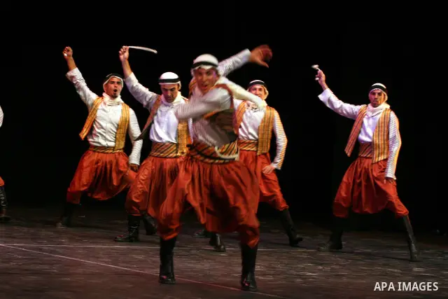 Palestinian folklore dance troupe perform during an annual cultural festival in the West Bank city of Ramallah on July 25, 2011. Photo by Issam Rimawi