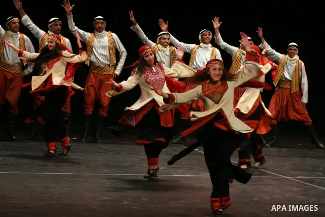 Palestinian folklore dance troupe perform during an annual cultural festival in the West Bank city of Ramallah on July 25, 2011. Photo by Issam Rimawi