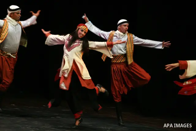 Palestinian folklore dance troupe perform during an annual cultural festival in the West Bank city of Ramallah on July 25, 2011. Photo by Issam Rimawi