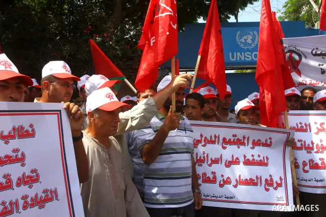 Palestinian supporters of the Democratic Front for the Liberation of Palestine (DFLP) take part in a demonstration infront of the UNSCO in Gaza city on July 26, 2011. In support of the Palestinian President Mahmoud abbas...