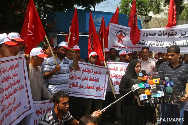 Palestinian supporters of the Democratic Front for the Liberation of Palestine (DFLP) deliver speech during a demonstration infront of the UNSCO in Gaza city on July 26, 2011. In support of the Palestinian President Mahm...