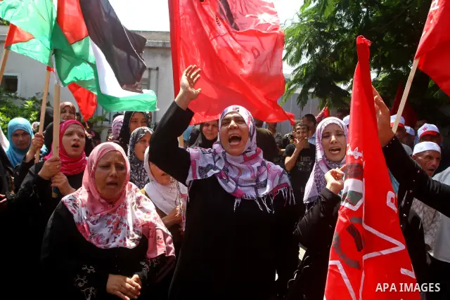 Palestinian supporters of the Democratic Front for the Liberation of Palestine (DFLP) take part in a demonstration infront of the UNSCO in Gaza city on July 26, 2011. In support of the Palestinian President Mahmoud abbas...