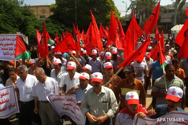 Palestinian supporters of the Democratic Front for the Liberation of Palestine (DFLP) take part in a demonstration infront of the UNSCO in Gaza city on July 26, 2011. In support of the Palestinian President Mahmoud abbas...