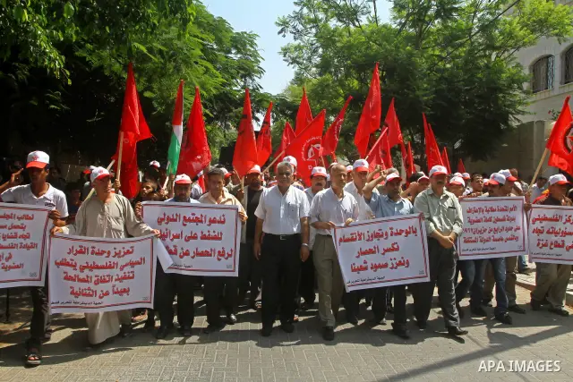Palestinian supporters of the Democratic Front for the Liberation of Palestine (DFLP) take part in a demonstration infront of the UNSCO in Gaza city on July 26, 2011. In support of the Palestinian President Mahmoud abbas...