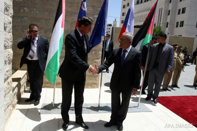 Palestinian Prime Minister Salam Fayyad, shakes hands with Slovenia's Prime Minister, Borut Pahor (L) before their meeting in the West Bank city of Ramallah on July 27, 2011. Photo by Issam Rimawi