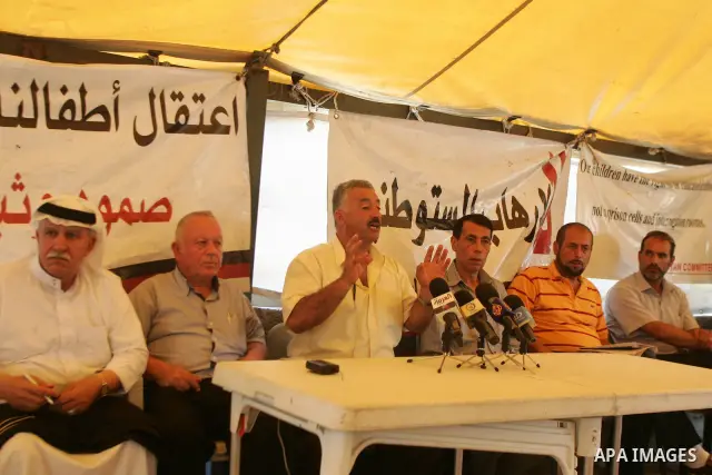 Palestinians take part in the press conference against the settlements, terrorism and the arrest of Palestinian children in the solidarity tent in silwan in Jerusalem on July 28, 2011. Photo by Mahfouz Abu Turk