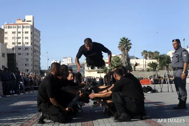 Palestinian Hamas security forces show their skills during a graduation ceremony at the Arafat police compound in Gaza City on July 28, 2011. Photo by Naaman Omar
