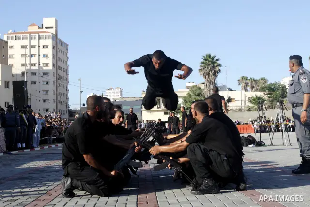 Palestinian Hamas security forces show their skills during a graduation ceremony at the Arafat police compound in Gaza City on July 28, 2011. Photo by Naaman Omar