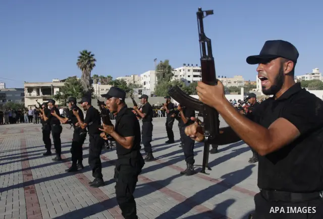 Palestinian Hamas security forces show their skills during a graduation ceremony at the Arafat police compound in Gaza City on July 28, 2011. Photo by Naaman Omar