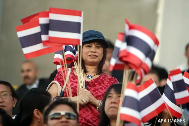Fans wave Thailand flags as they cheer during the 2014 FIFA World Cup qualification soccer match between Thailand and the Palestinian Territories at A-Ram stadium near Jerusalem July 28, 2011. Photo by Issam Rimawi