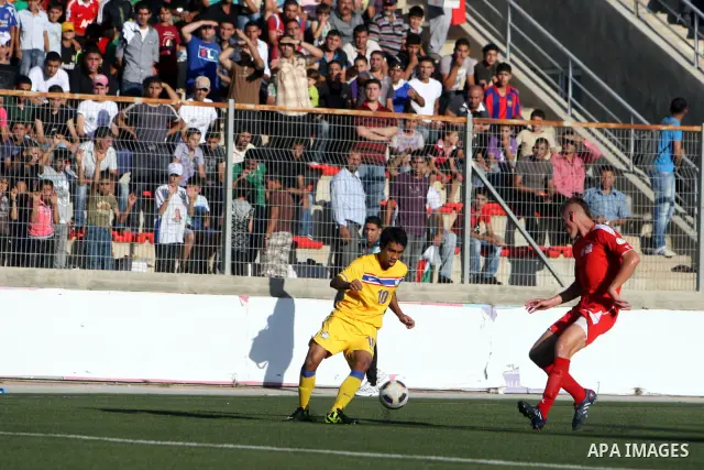 Palestinian's team and Thailand's team fight for the ball during their 2014 FIFA World Cup qualification soccer match at A-Ram stadium near Jerusalem July 28, 2011. Photo by Issam Rimawi