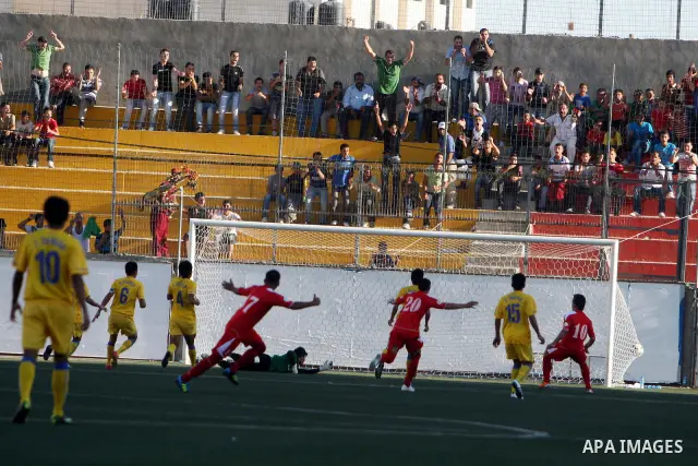 Palestinian's team and Thailand's team fight for the ball during their 2014 FIFA World Cup qualification soccer match at A-Ram stadium near Jerusalem July 28, 2011. Photo by Issam Rimawi