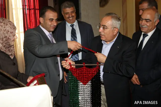 Palestinian Prime Minister, Salam Fayyad during the closing session of al-wafaa` conference of the Palestinian products in the West Bank city of Qalqilya on July 28, 2011. Photo by Mustafa Abu Dayeh