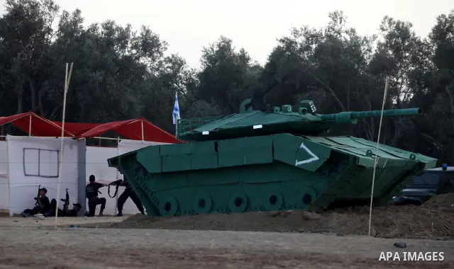 New graduates of a Palestinian Hamas military camp, ages 12-18, perform mock exercises during a graduation ceremony in Gaza City, on July 29, 2011. Photo by Majdi Fathi