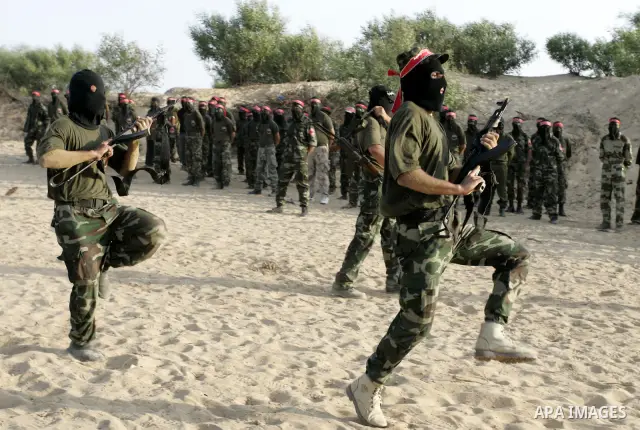Militants of the Democratic Front for Liberation Palestine (DFLP) train during a military graduation ceremony in Rafah, southern Gaza Strip, on July 29, 2011. Photo by Abed Rahim Khatib