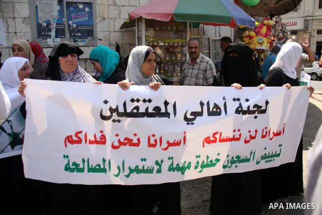 Palestinian women attend a protest demanding the release of arrested and imprisoned family members held for political reasons by the Palestinian Authority Security Forces, in the West Bank city of Nablus, on July 30, 201...