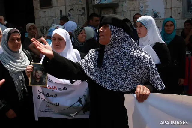 Palestinian women attend a protest demanding the release of arrested and imprisoned family members held for political reasons by the Palestinian Authority Security Forces, in the West Bank city of Nablus, on July 30, 201...