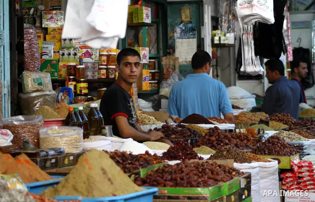 Palestinians shop for food ahead of the Muslim holy fasting month of Ramadan at Al-Zawiya market in Gaza City on July 30, 2011. Photo by Ashraf Amra