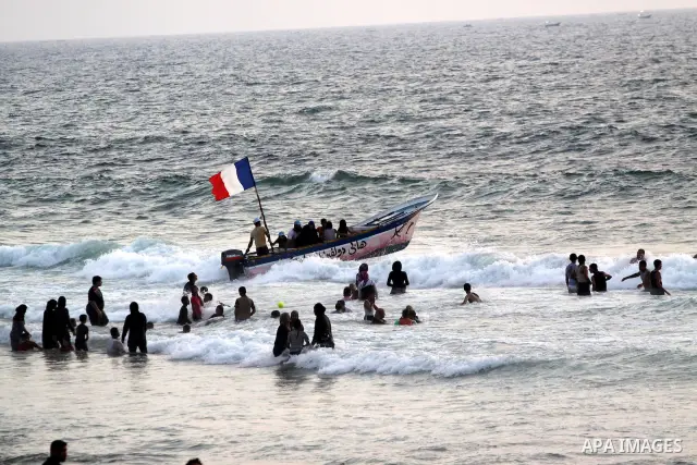 Palestinians enjoy swimming at the beach in Gaza city on July 30, 2011. Photo by Mohammed Asad