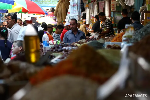 Palestinians shop for food ahead of the Muslim holy fasting month of Ramadan at Al-Zawiya market in Gaza City on July 31, 2011. Photo by Ashraf Amra