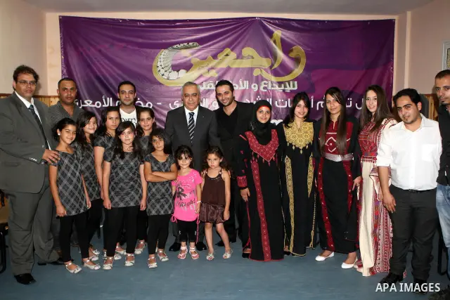 Palestinian Prime Minister, Salam Fayyad during his visit to the Palestinian Child Club and the band coming back "Rageen" in al-Amari Refugee Camp in the west Bank city of Ramallah on July 31, 2011. Photo by Mustafa Abu...