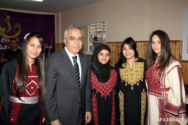 Palestinian Prime Minister, Salam Fayyad during his visit to the Palestinian Child Club and the band coming back "Rageen" in al-Amari Refugee Camp in the west Bank city of Ramallah on July 31, 2011. Photo by Mustafa Abu...