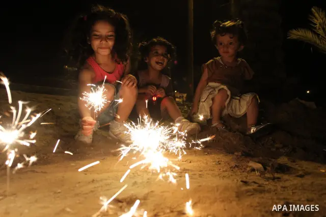 Palestinian children enjoy playing with fire crackers celebrating ahead of the Muslim holy month of Ramadan in Gaza city on July 31, 2011. Photo by Mohammed Asad