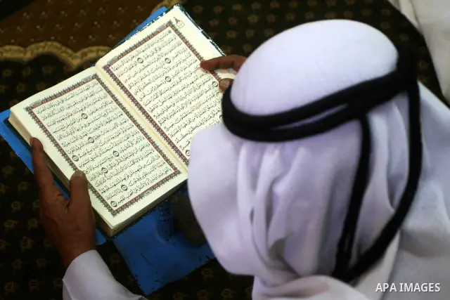 A Palestinian man reads the holy koran on the first day of holy fasting month of Ramadan at al-Omari mosque in Gaza city on Aug. 1, 2011. Throughout the holy month of Ramadan devout Muslims must abstain from food, drink...