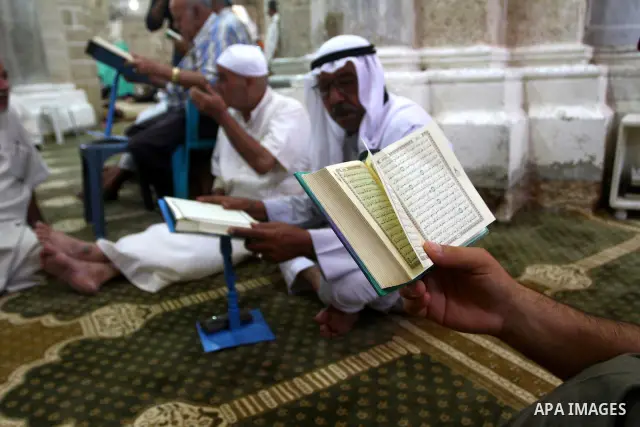 Palestinian men read the holy koran on the first day of holy fasting month of Ramadan at al-Omari mosque in Gaza city on Aug. 1, 2011. Throughout the holy month of Ramadan devout Muslims must abstain from food, drink and...