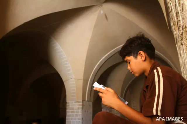 A Palestinian boy reads the holy koran on the first day of holy fasting month of Ramadan at al-Omari mosque in Gaza city on Aug. 1, 2011. Throughout the holy month of Ramadan devout Muslims must abstain from food, drink...